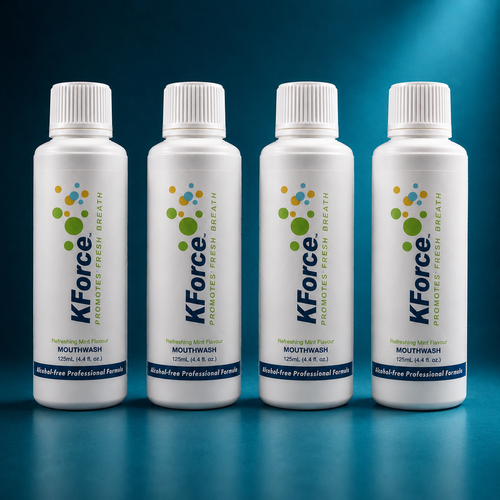 Four white bottles of KForce mouthwash arranged in a row against a dark blue gradient background. Each bottle features a white cap, a white body with blue and green branding, and a blue label at the bottom.